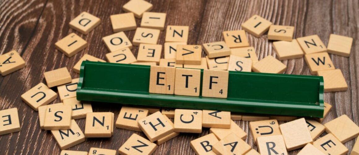 the word etf on a wooden board with scrabble tiles